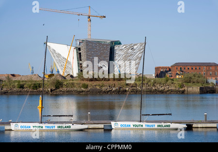 Titanic Museum under construction with Ocean Youth Trust boats in foreground. Stock Photo