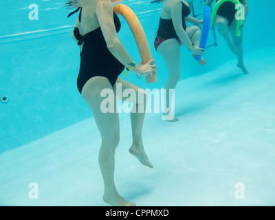 PREGNANT WO. EXERCISING IN WATER Stock Photo
