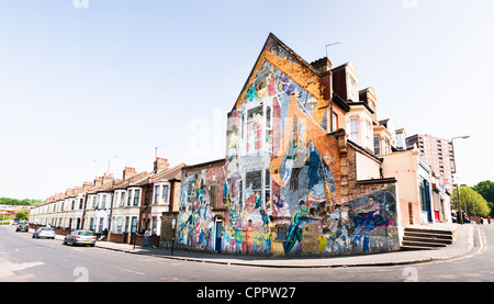 View The Floyd Road Mural, a large painting by Greenwich Mural Workshop (1976) on the gable wall of a house in Charlton, London. Stock Photo