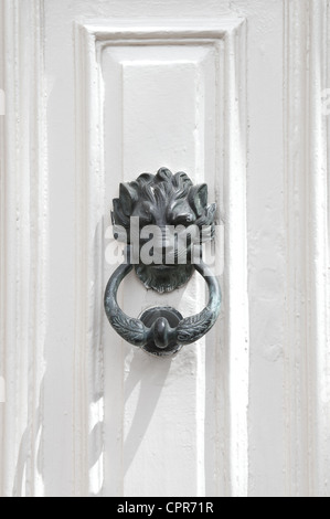 Bronze lion door knocker on white door in Mdina, Malta. Stock Photo