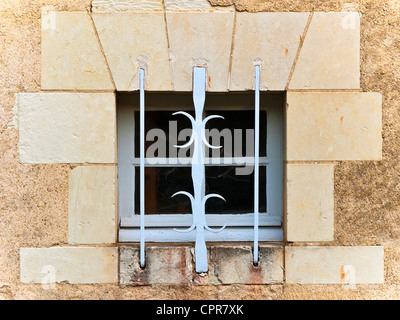 Old house window protected with wrought-iron bars - France. Stock Photo