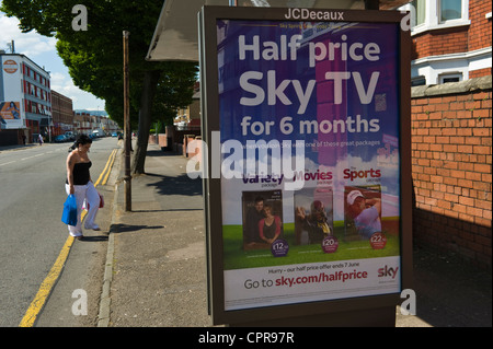 JCDecaux advertising billboard for HALF PRICE SKY TV on bus shelter in Newport South Wales UK Stock Photo