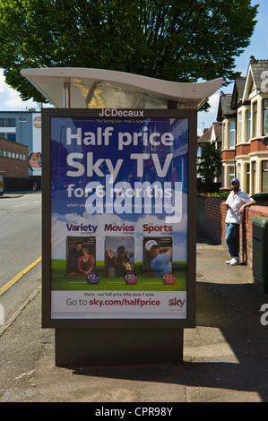 JCDecaux advertising billboard for HALF PRICE SKY TV on bus shelter in Newport South Wales UK Stock Photo