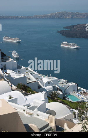 Imerovigli on Santorini with cruise ships in the harbour Stock Photo