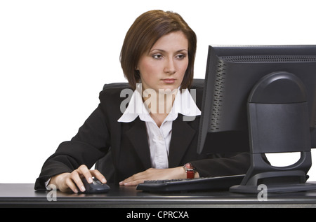 Businesswoman working on the computer at her workplace. Stock Photo