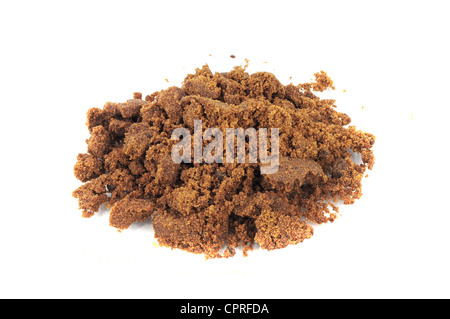 Closeup of pile of brown sugar isolated on white Stock Photo