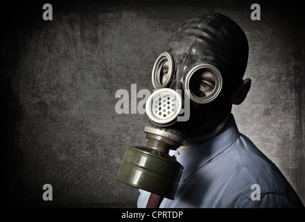 businessman wear gas mask grunge background Stock Photo