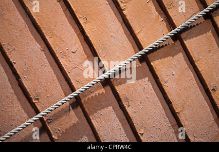 texture of ship's wooden hull with rope Stock Photo