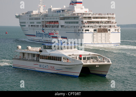 Wightlink passenger ferry Wight Ryder II inbound to Portsmouth UK Outbound is Brittany Ferries Pont Aven Stock Photo