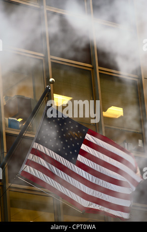 American flag, obscured by steam cloud, flying outside office building, Manhatan