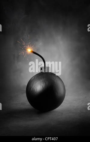 A Cartoon-style round black bomb with a burning fuse. Stock Photo