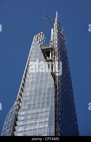 Top of the Shard skyscraper aka the London Bridge Tower and glass windows of office buildings, London, England Stock Photo