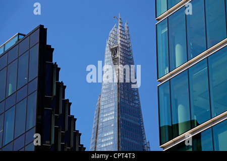 Top of the Shard skyscraper aka the London Bridge Tower and glass windows of office buildings, London, England Stock Photo