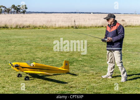 Man about to take off Radio Control RC airplane flying hobby Stock Photo