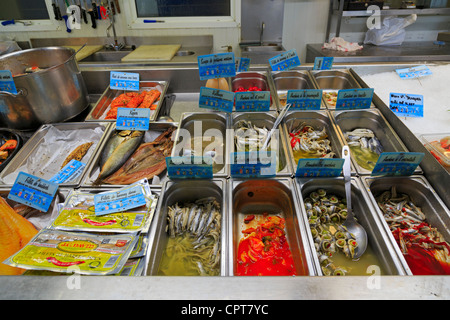 Prepared fresh and smoked fish at the market in Honfleur, France. Stock Photo