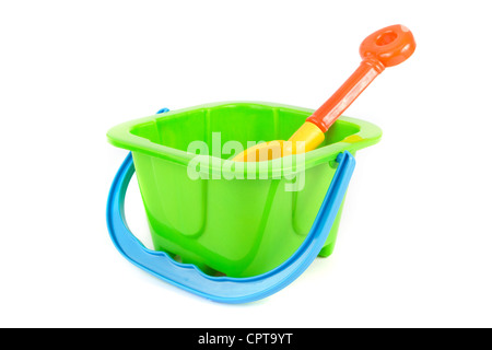 Kids green bucket and spade on white Stock Photo