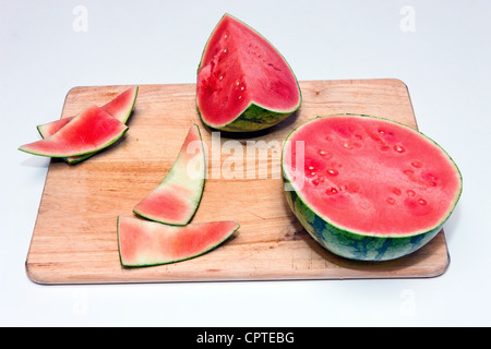 Slices of ripe watermelon on cutting board Stock Photo