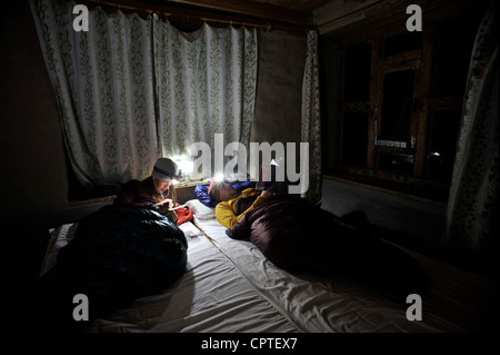 Couple in room in sleeping bags, Yak Kharka, Nepal Stock Photo