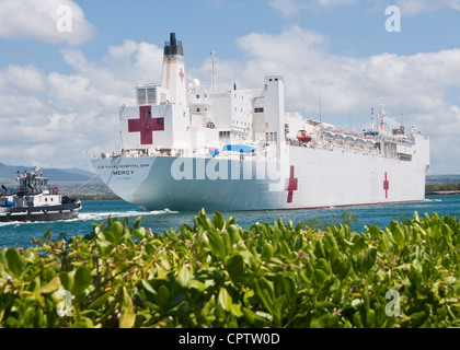 The Military Sealift Command hospital ship USNS Mercy (T-AH 19) arrives at Joint Base Pearl Harbor-Hickam during a deployment in support of Pacific Partnership 2012. Pacific Partnership is the seventh in a series of U.S. Pacific Fleet-sponsored humanitarian and civic assistance missions that work to strengthen regional relationships and to collectively respond to natural disasters in southeast Asia and the western Pacific region. Stock Photo