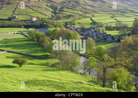 View from above Burnsall village in spring, River Wharfe and distant hillside, Yorkshire Dales national park, North Yorkshire,UK Stock Photo