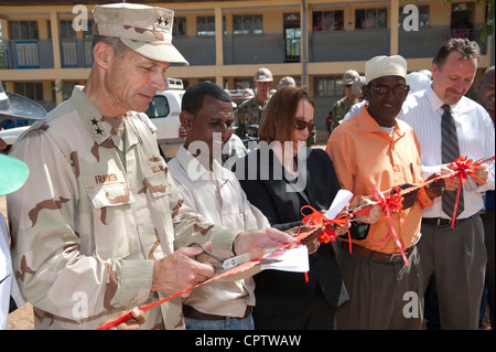 Rear Admiral Michael Franken, left, commander of Combined Joint Task Force Horn of Africa, Kumsa Baysa, principal of Gende Gerada Primary School, Molly Phee, deputy chief of mission at the U.S. Embassy in Ethiopia, Egei Wabere, an Gende Gerada Kebele education coordinator, and Stephen Fitzpatrick, program coordinator for U.S. Agency for International Development gather for a school building dedication and ribbon cutting ceremony for a new school house and two latrines at the Gende Gerada Primary School. Stock Photo