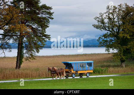 Tourist bus at Konigschloss Herrenchiemsee castle on Herren Insel island in Chiemsee Lake, Baden-Wurttenberg, Bavaria, Germany Stock Photo