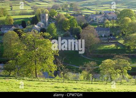 View from above Burnsall village in spring, River Wharfe and distant hillside, Yorkshire Dales national park, North Yorkshire,UK Stock Photo