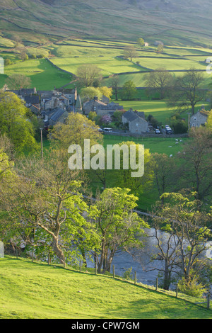 View from above Burnsall village in spring, River Wharfe and distant hillside, Yorkshire Dales national park, North Yorkshire,UK Stock Photo