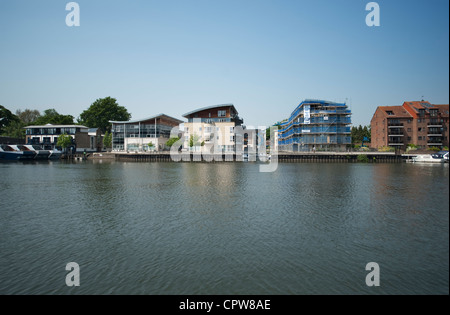 The riverside at Kingston upon Thames in south west London with flats being developed on the Hampton Wick bank of the river Stock Photo