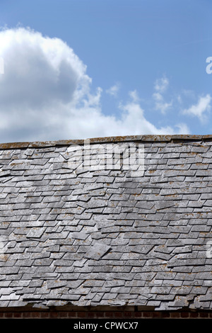 Old slate roof in need of repair, England, UK Stock Photo
