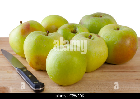 Organic Ballarat cooking or baking apples on chopping board, ready for preparation. Background isolated with clipping path. Stock Photo
