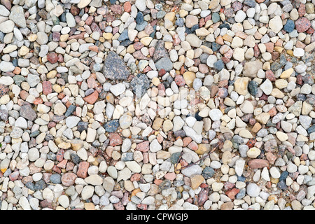 Texture from small multi-colored stones on rural road background Stock Photo