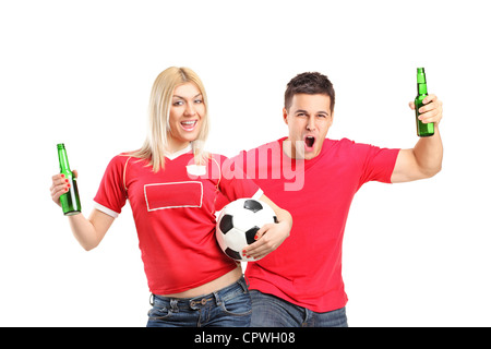 Male and female euphoric fans holding beer bottles and football cheering isolated on white background Stock Photo