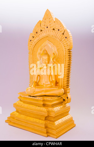 Golden Khmer Buddha statue and pedestal against white background - Siem Reap Province, Cambodia Stock Photo