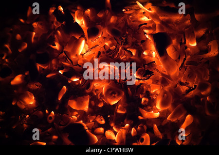 Red burning coals dark abstract background Stock Photo