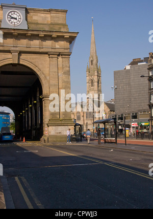 The portico of the Central Station, Newcastle-upon-Tyne, with St. Mary's Cathedral in the background. Stock Photo