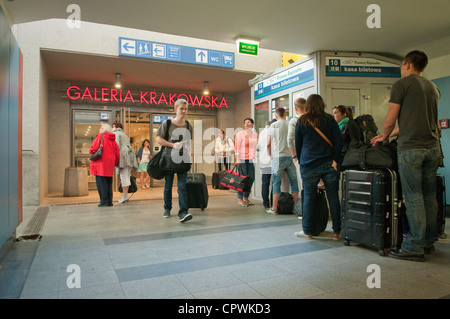 Queue for train tickets in railway station underpass, Krakow, Poland. Stock Photo
