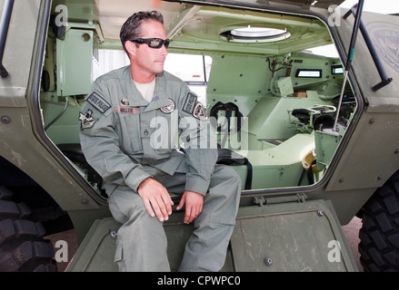 male member of the Texas Department of Public Safety SWAT Team, division Texas Rangers sits in armored vehicle during exercise Stock Photo