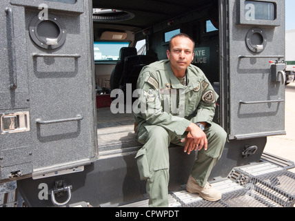 male member of the Texas Department of Public Safety SWAT Team, division Texas Rangers sits in armored vehicle during exercise Stock Photo