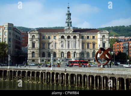 Bilbao's grand Town Hall, with pilings along the River Bilbao in the foreground, viewed from across the river Stock Photo