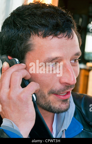 Young man talking on smartphone - France. Stock Photo
