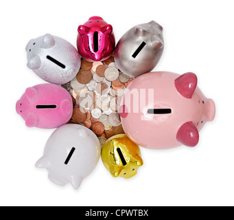 Seven piggy banks and UK coins Stock Photo