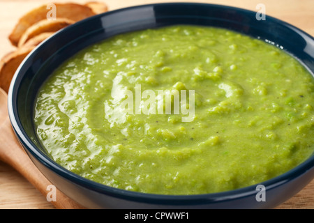 A bowl of thick, fresh, pea soup. Stock Photo