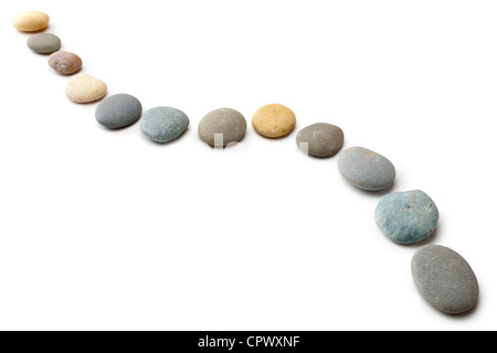 Snaking line of twelve coloured pebbles isolated on white. Clipping path for stones. Stock Photo