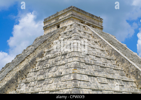White puffy clouds over Mayan Pyramid of Kukulkan (also known as El Castillo) and ruins at Chichen Itza Yucatan Peninsula Mexico Stock Photo