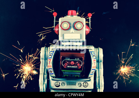 old robot and sparks Stock Photo