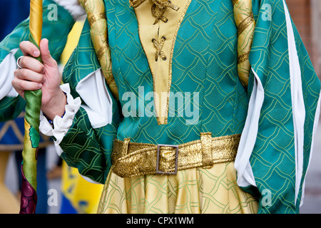 Contrada member in livery costumes for traditional parade in Asciano, inTuscany, Italy Stock Photo