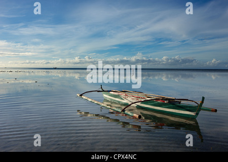 a man collecting shells during low tide, Siquijor, The Visayas, Philippines Stock Photo