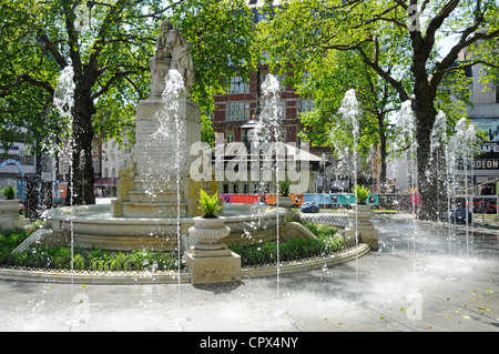 New fountains in the refurbished Leicester Square gardens with William Shakespeare statue West End  London England UK Stock Photo