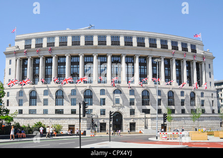 Unilever House headquarters curved Neoclassical Art Deco office building frontage facade with union jack flags Blackfriars City of London England UK Stock Photo